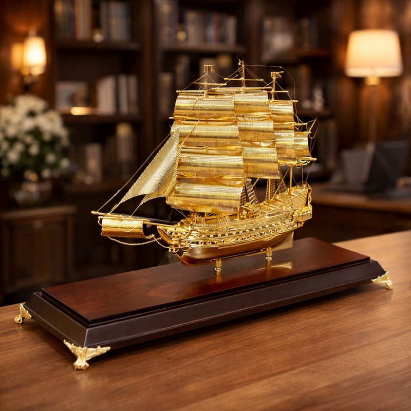 thuyền buồm mạ vàng biểu tượng thành công bền vững
